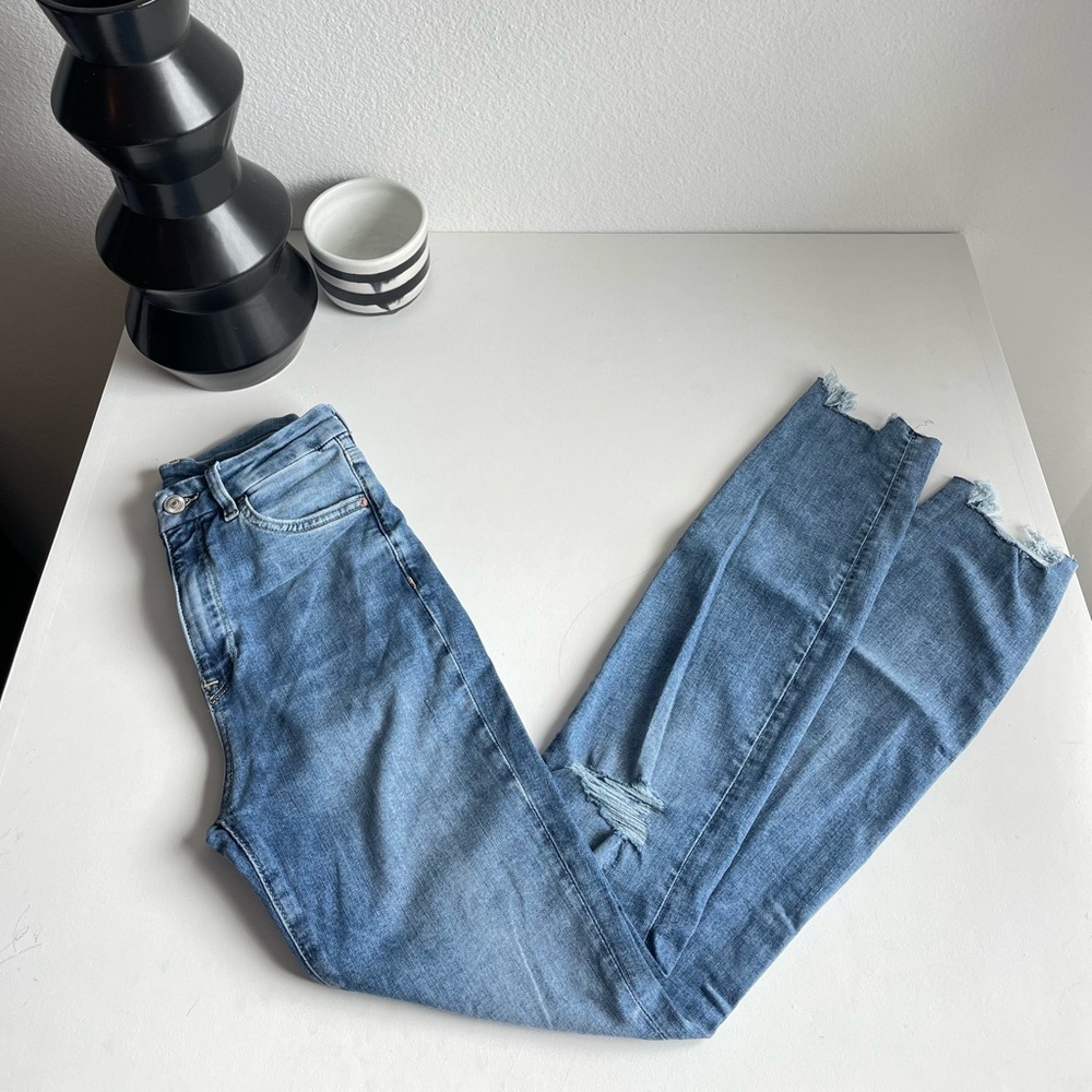 Skinny Blue Jeans with Distressed Bottom